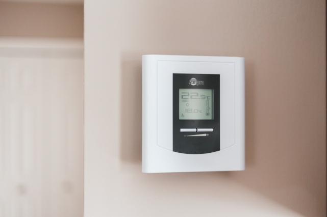A black and white thermostat.