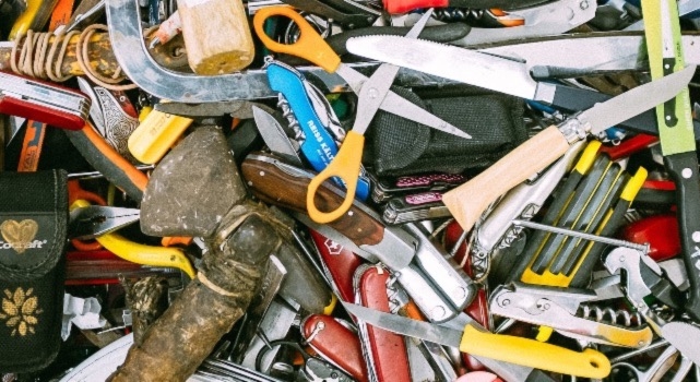 Various tools a homeowner should have, scattered around.