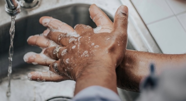 A person washing their hands